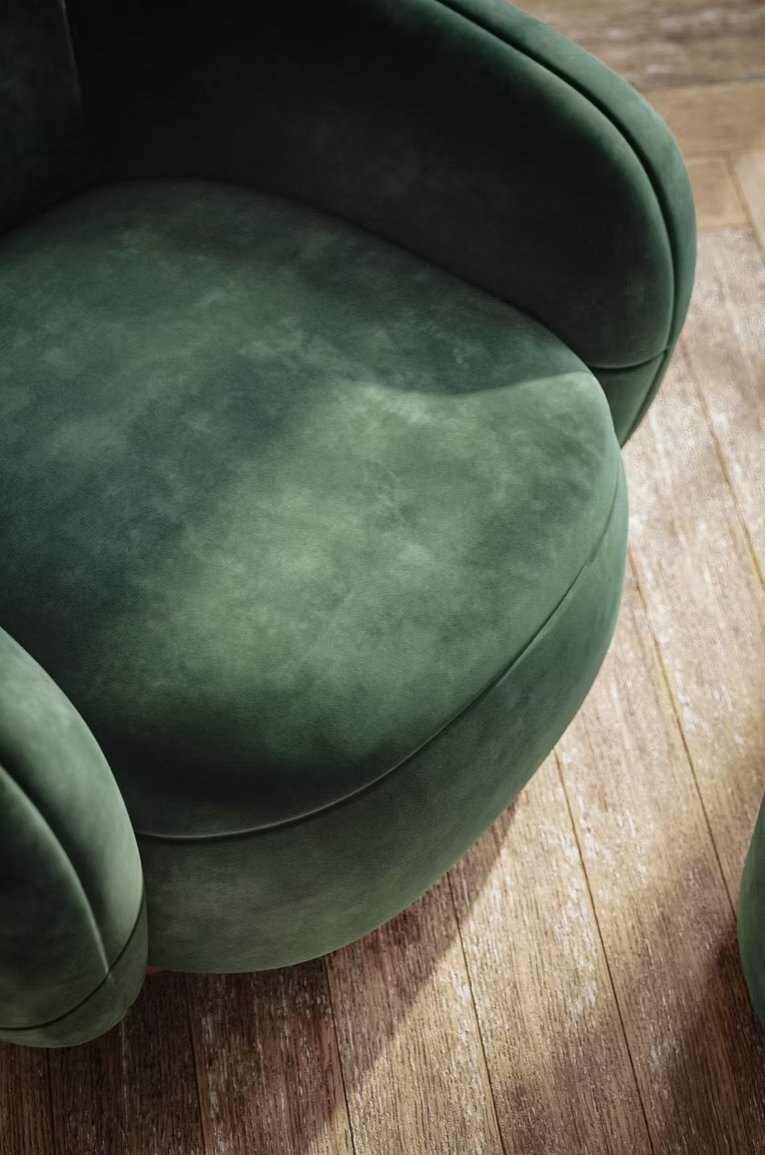 Close-up furniture CGI showing green upholstery texture and rounded chair form